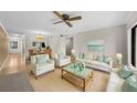 Bright living room with comfy sofas, coffee table, and large windows at 2679 Sabal Springs Cir # 203, Clearwater, FL 33761