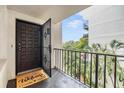 Welcoming entryway with a balcony offering a view of the courtyard at 2699 Seville Blvd # 403, Clearwater, FL 33764