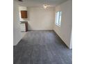 Bright dining room with grey carpet and chandelier at 12954 Fennway Ridge Dr, Riverview, FL 33579