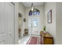 Bright and airy entryway with decorative accents and tile floors at 8037 Shaddock Pl, Land O Lakes, FL 34637