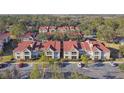 Aerial view of condo community showing building arrangement at 9481 Highland Oak Dr # 807, Tampa, FL 33647