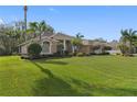 Spacious home with a well-maintained lawn and palm trees at 2914 Shipston Ave, New Port Richey, FL 34655