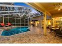 Inviting pool and patio area with covered lanai and lounge chairs at 2914 Shipston Ave, New Port Richey, FL 34655