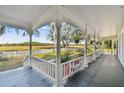 Spacious wrap-around porch overlooking a large backyard at 301 Old Hopewell Rd, Plant City, FL 33567