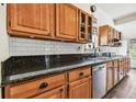 Renovated kitchen with granite countertops and wood cabinets at 301 Old Hopewell Rd, Plant City, FL 33567