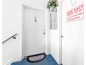 Apartment entryway with fire extinguisher and welcome mat at 1122 84Th N Ter # C, St Petersburg, FL 33702