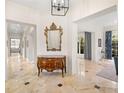 Elegant entryway with marble floors and ornate furniture at 4520 W Woodmere Rd, Tampa, FL 33609