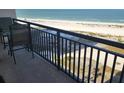 Balcony with table and chairs overlooking the beach at 1270 Gulf Blvd # 1102, Clearwater Beach, FL 33767