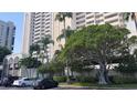 High rise building with lush landscaping at 1270 Gulf Blvd # 1102, Clearwater Beach, FL 33767