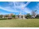 Park gazebo with American flag, playground view at 13419 Lake Monroe Pl, Riverview, FL 33579