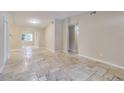 Living area with tile flooring and access to other rooms at 2906 Martha Ln, Land O Lakes, FL 34639