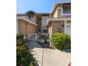 Front entry of townhouse with walkway and small courtyard at 3077 Branch, Clearwater, FL 33760