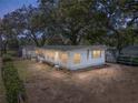 Single story home with yard at dusk at 37814 Daughtery Rd, Zephyrhills, FL 33541