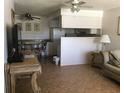 Open concept kitchen and living area, with a breakfast bar at 6177 Chesham Dr # 6, New Port Richey, FL 34653