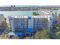 Aerial view of a condo building with parking and waterfront access at 7902 Sailboat Key S Blvd # 405, South Pasadena, FL 33707