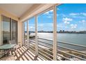 Spacious balcony with stunning waterfront views and seating area at 7902 Sailboat Key S Blvd # 405, South Pasadena, FL 33707