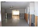 Under renovation: living room features tiled floors and exposed walls at 215 176Th Terrace E Dr, Redington Shores, FL 33708