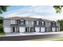 Modern townhome development featuring gray exteriors and attached garages at 32615 Turtle Grace Loop, Wesley Chapel, FL 33545