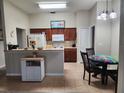 Cozy kitchen featuring a breakfast bar and ample cabinet space at 3604 Harvest Orchard Dr, Plant City, FL 33567
