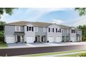 New townhome community with attached garages and attractive landscaping at 481 Mangrove Shade Cir, Apollo Beach, FL 33572