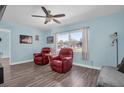 Living room with two red armchairs and wood floors at 4825 Dr Martin Luther King Jr S St, St Petersburg, FL 33705