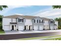 Modern townhouses with attached garages and neutral color palettes at 483 Mangrove Shade Cir, Apollo Beach, FL 33572