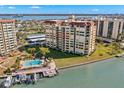 Condo building showcasing unit with water views at 700 Island Way # 704, Clearwater Beach, FL 33767