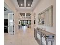 Bright and spacious entryway with tile flooring and views to the living area at 9152 Warm Springs Cir, Parrish, FL 34219