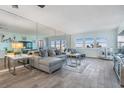 Spacious living room with large mirror and ocean view at 1230 Gulf Blvd # 604, Clearwater Beach, FL 33767