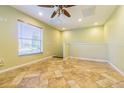 Spacious bonus room with tile flooring and window coverings at 131 Mystic Lake N Dr, St Petersburg, FL 33702