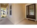 Charming front entry with decorative glass door and sidelight windows, creating a welcoming first impression at 1838 Tallulah Ter, Wesley Chapel, FL 33543