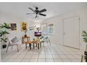 Bright living room featuring tiled floors and comfy seating at 2420 Winding Creek Blvd # 206, Clearwater, FL 33761