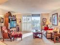 Bright living room with access to a balcony and hardwood floors at 2611 Bayshore Blvd # 302, Tampa, FL 33629