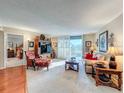 Living room with hardwood floors, comfortable seating, and bedroom view at 2611 Bayshore Blvd # 302, Tampa, FL 33629