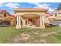 Covered entryway to large estate with columns and attached garage at 309 Pruett Rd, Seffner, FL 33584