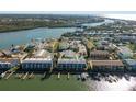 Aerial view of waterfront community with boat slips at 318 Windrush Blvd # 10, Indian Rocks Beach, FL 33785
