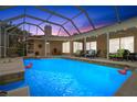 Inviting pool area with covered lanai and comfortable seating at 6000 51St S St, St Petersburg, FL 33715