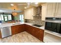 Modern kitchen with stainless steel appliances and quartz countertops at 12200 Vonn Rd # 2109, Largo, FL 33774