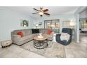 Spacious living room with comfortable seating and tile floors at 1597 Franklin Way, Dunedin, FL 34698