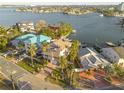 An aerial view of a house on the waterfront, showcasing its location at 238 71St Ave, St Pete Beach, FL 33706