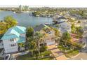 An aerial view of a house on the water, showing surrounding houses at 238 71St Ave, St Pete Beach, FL 33706