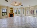 Spacious living room with fireplace and tile floors at 2741 Via Cipriani # 930A, Clearwater, FL 33764