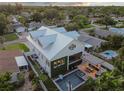 Aerial view of modern home, pool, and outdoor kitchen at 4329 Helena Ne St, St Petersburg, FL 33703