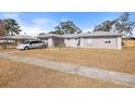 One-story house with a minivan parked in front at 7143 Pear Ln, Spring Hill, FL 34606