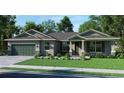 One-story home with green garage door and stone accents at 15084 Mcgraw Ave, Port Charlotte, FL 33953