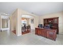 Home office with built-in wooden desk and cabinets at 20314 Chestnut Grove Dr, Tampa, FL 33647