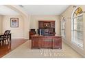 Bright home office features a large desk and built-in shelving at 20314 Chestnut Grove Dr, Tampa, FL 33647