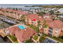 Aerial view showcasing condo building, pool, and marina at 5000 Culbreath Key Way # 4303, Tampa, FL 33611