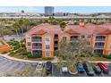 Aerial view of condo building with parking and water access at 5000 Culbreath Key Way # 4303, Tampa, FL 33611