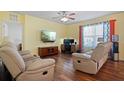Two armchairs, a TV, and a workspace at 5119 11Th E St, Bradenton, FL 34203